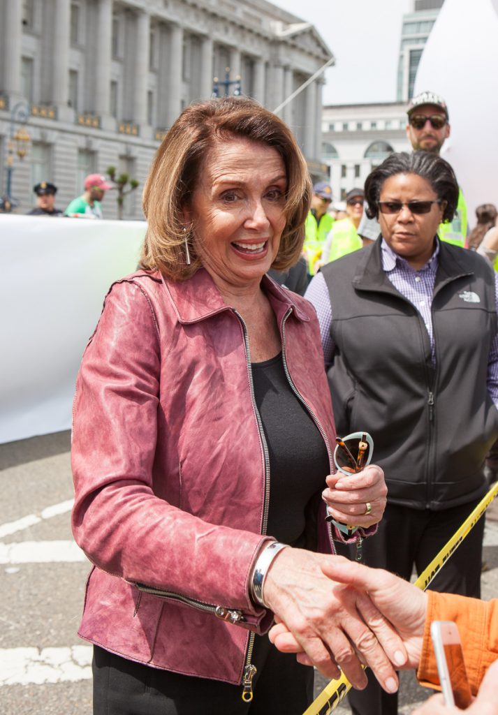 Nancy Pelosi shaking hands