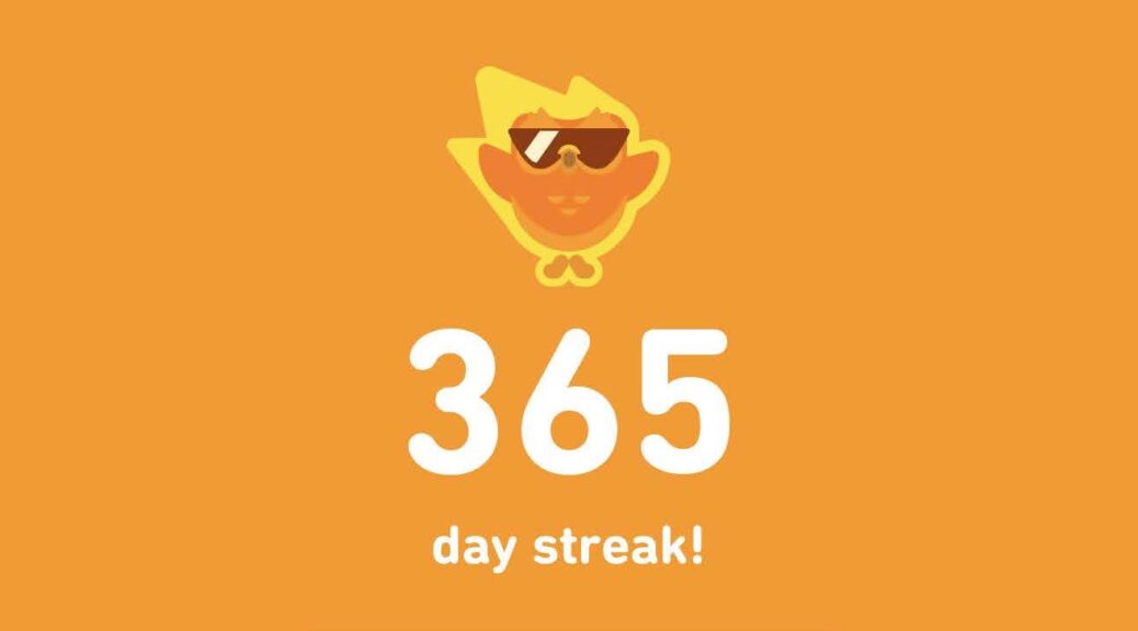 Screenshot from Duolingo, with the owl wearing sunglasses and the words “365 day streak!
